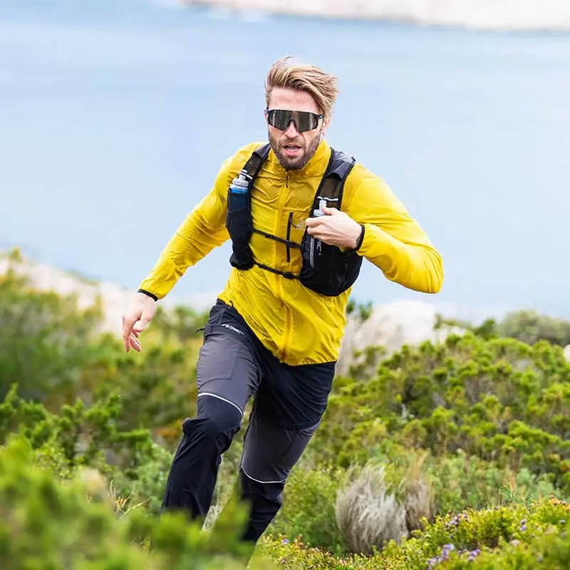 Unit Light vindjacka för män, mangomint/guldpalm